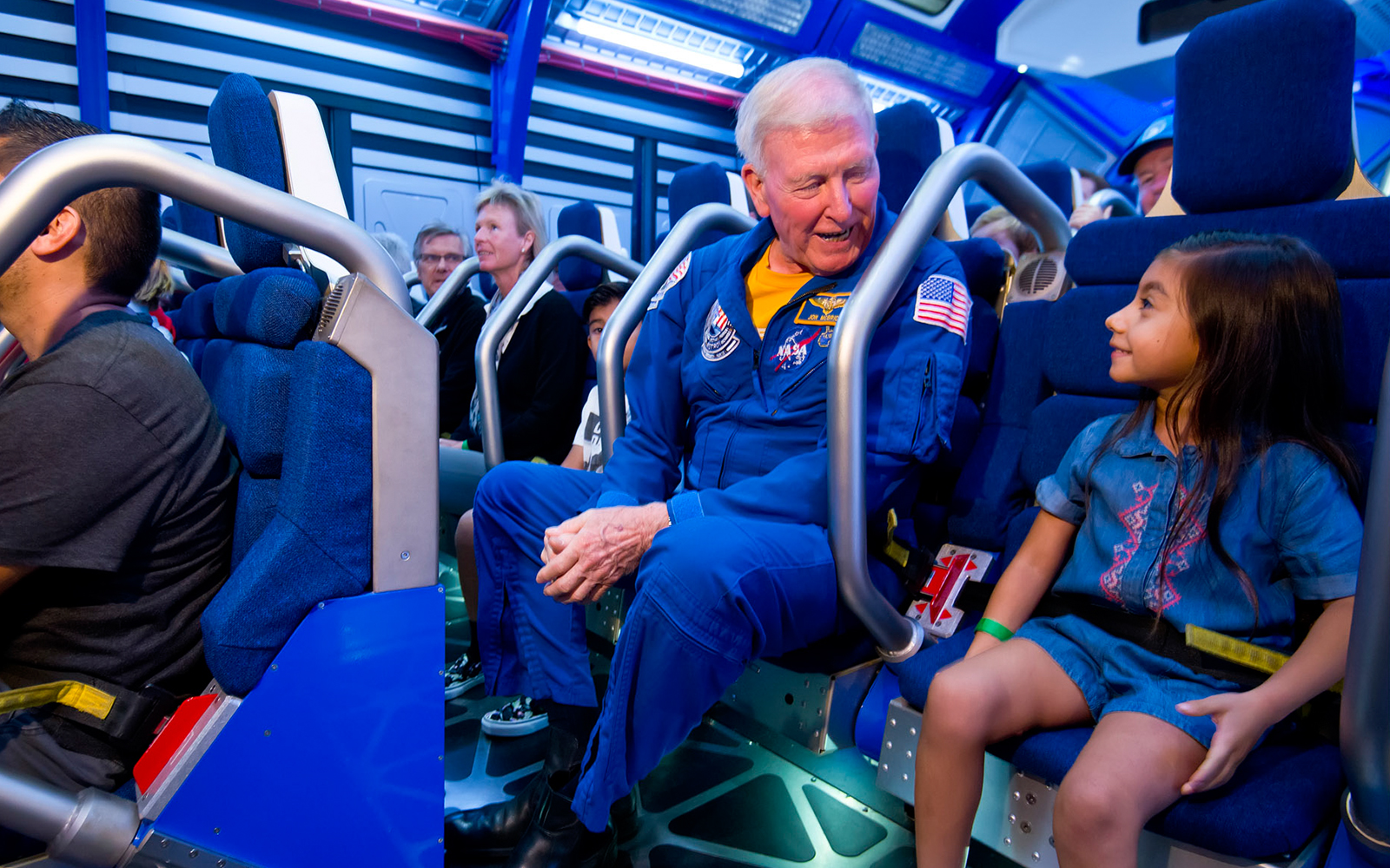 Astronaut guiding visitors at Kennedy Space Center's Fly With An Astronaut experience.