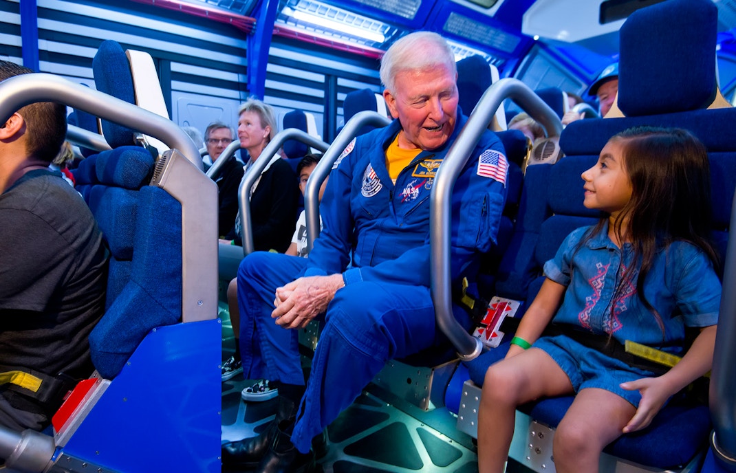 Astronaut guiding visitors at Kennedy Space Center's Fly With An Astronaut experience.