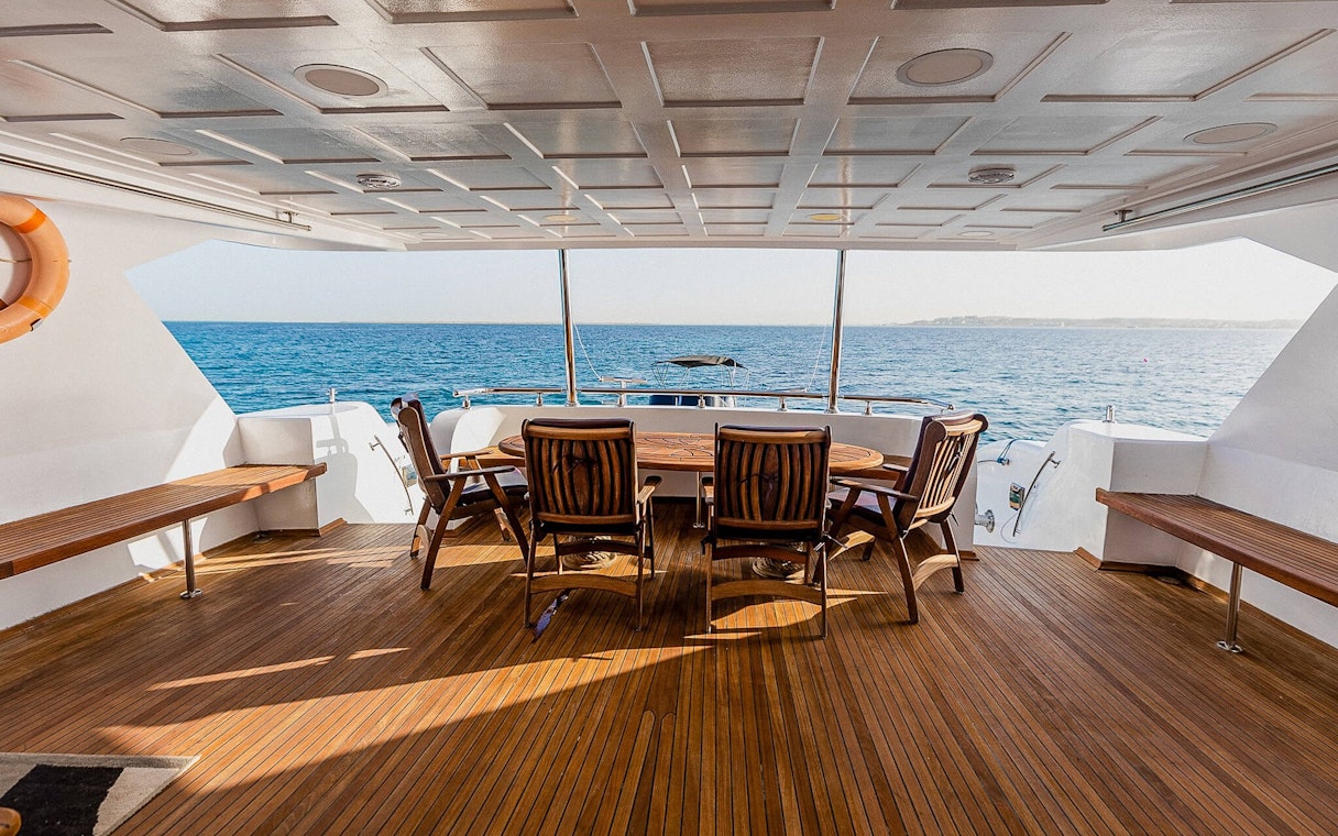 Deck of the Royal 1 motor yacht with seating, overlooking Orange Bay, Red Sea, Hurghada.