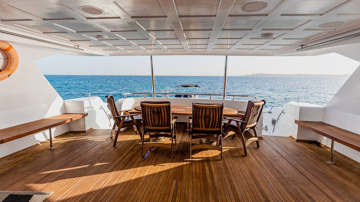 Deck of the Royal 1 motor yacht with seating, overlooking Orange Bay, Red Sea, Hurghada.