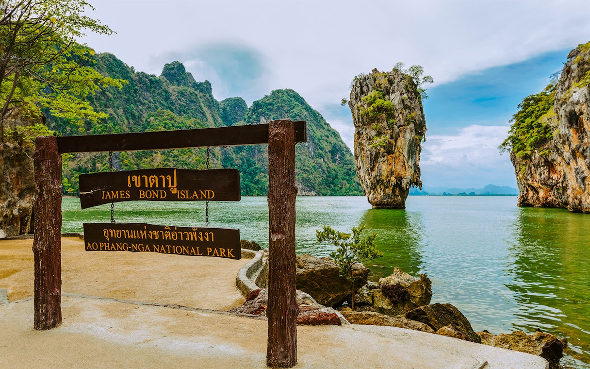 James Bond Island sign with limestone karst in Ao Phang Nga National Park, Thailand.