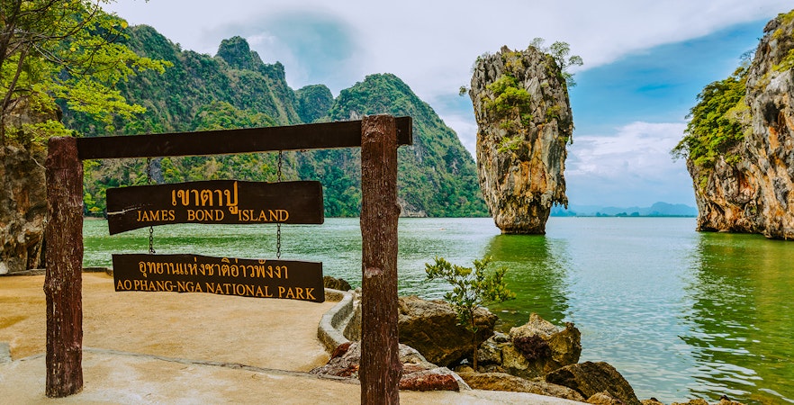 James Bond Island sign with limestone karst in Ao Phang Nga National Park, Thailand.