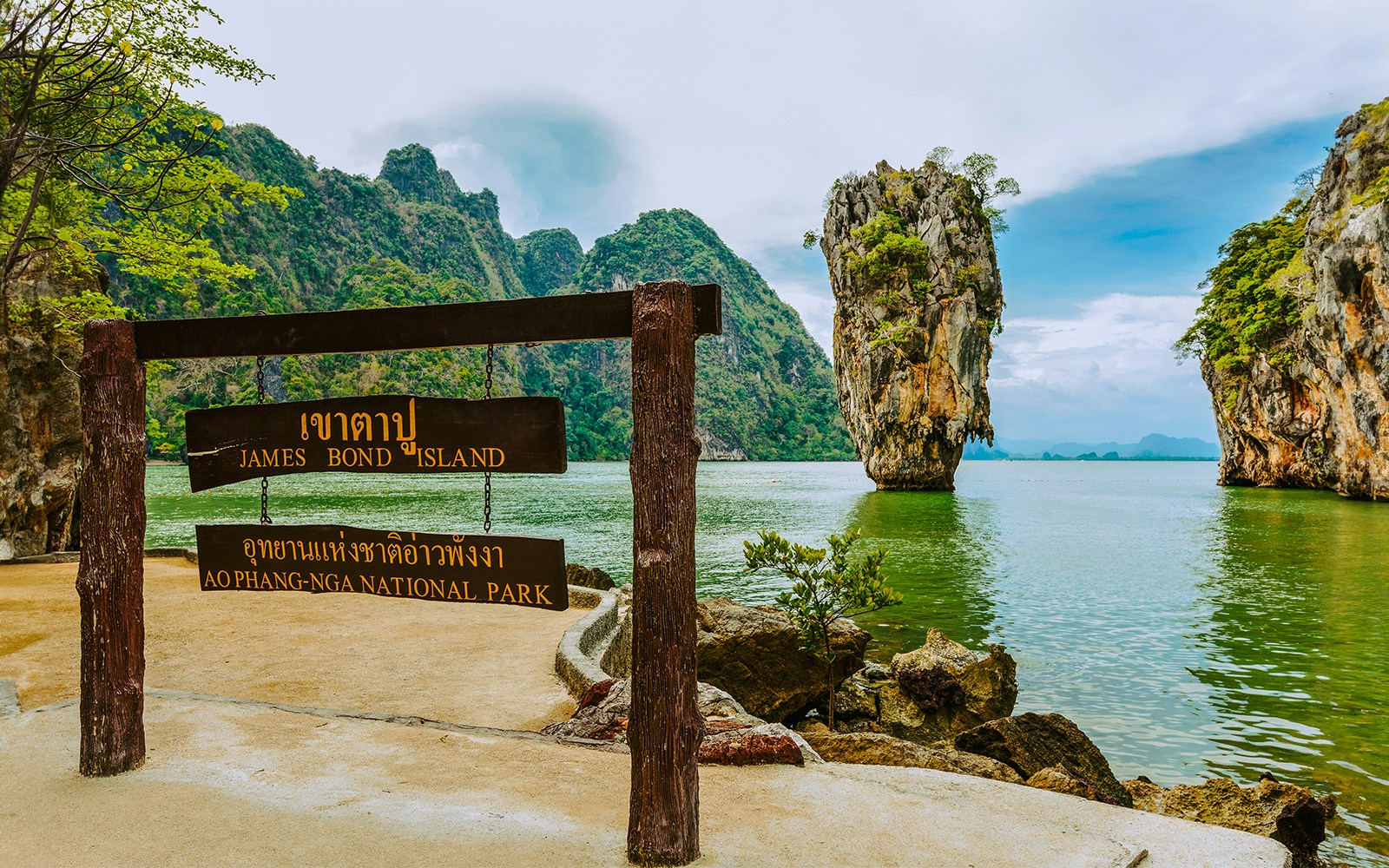 James Bond Island sign with limestone karst in Ao Phang Nga National Park, Thailand.