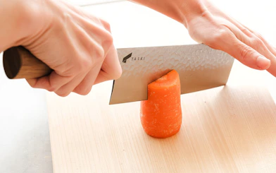 Cutting a carrot during Tokyo Ramen and Gyoza Cooking Class.