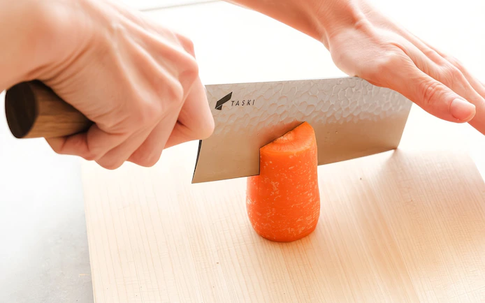 Cutting a carrot during Tokyo Ramen and Gyoza Cooking Class.