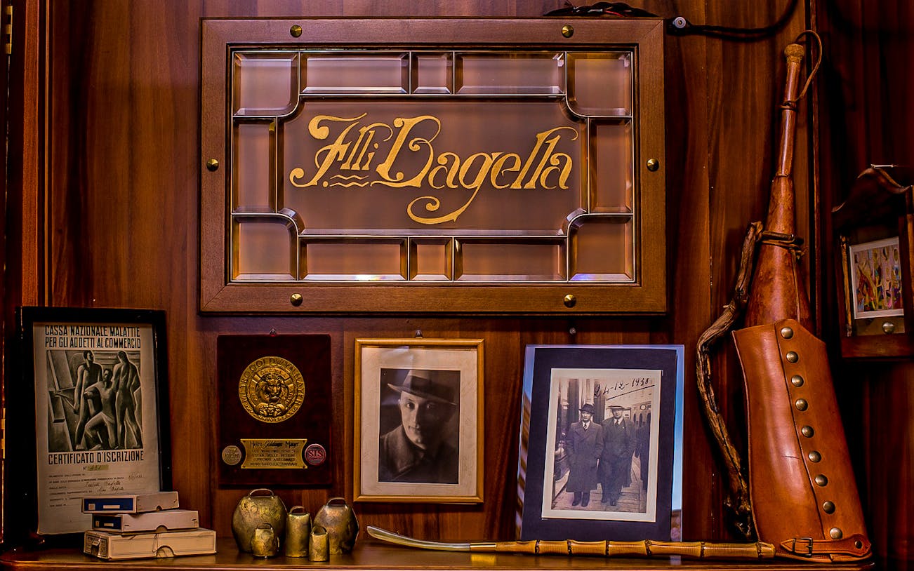Bagella Brothers memorabilia display in Sassari, featuring historical photos and awards.