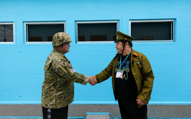 Soldiers shaking hands at the DMZ during the Half Day DMZ Tour with JSA Photo Zone.