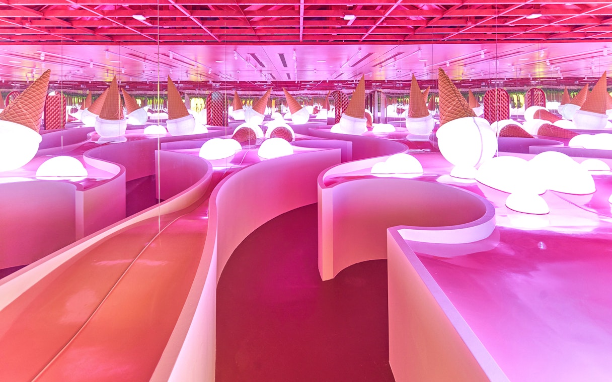Ice cream-themed room with pink slides at Museum of Ice Cream Singapore.