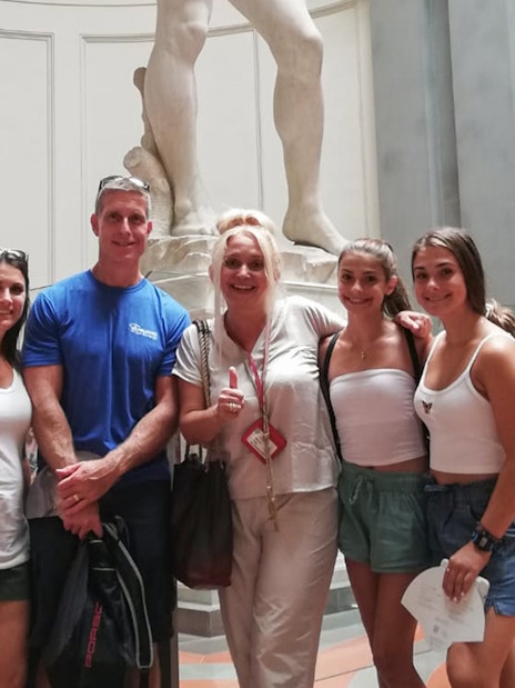 Visitors at Accademia Gallery with Michelangelo's David in Florence.