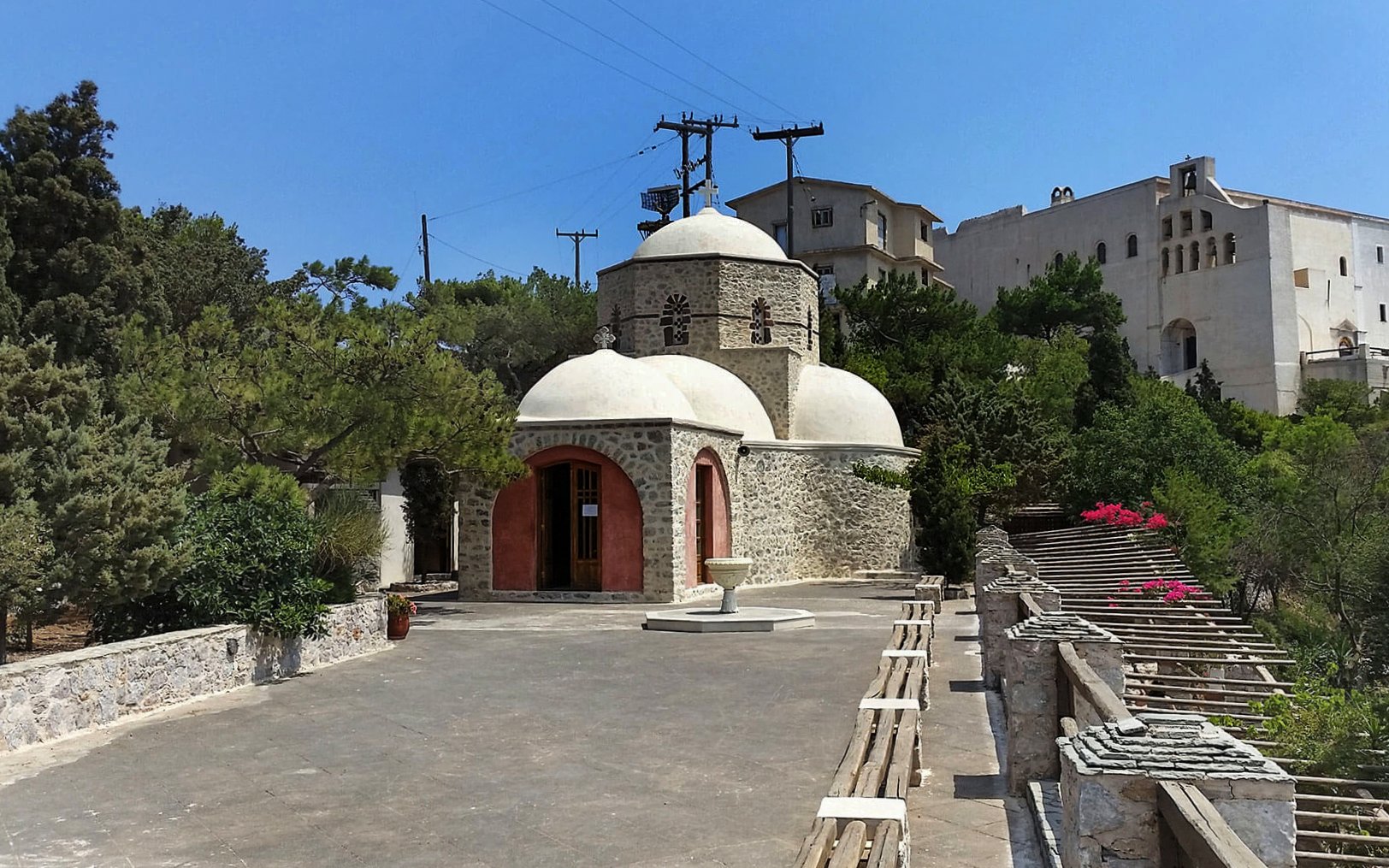 Prophet Elias Monastery with stone architecture and domes, Santorini.