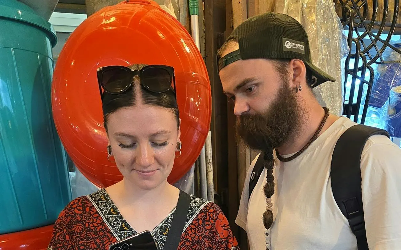 Two people exploring a market in Doha during a self-guided city exploration game.