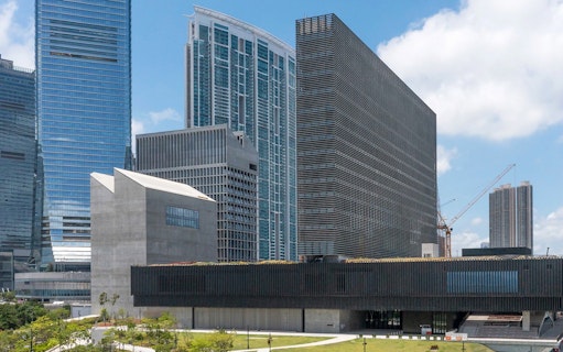 M+ Museum exterior with surrounding skyscrapers in Hong Kong.