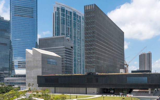 M+ Museum exterior with surrounding skyscrapers in Hong Kong.