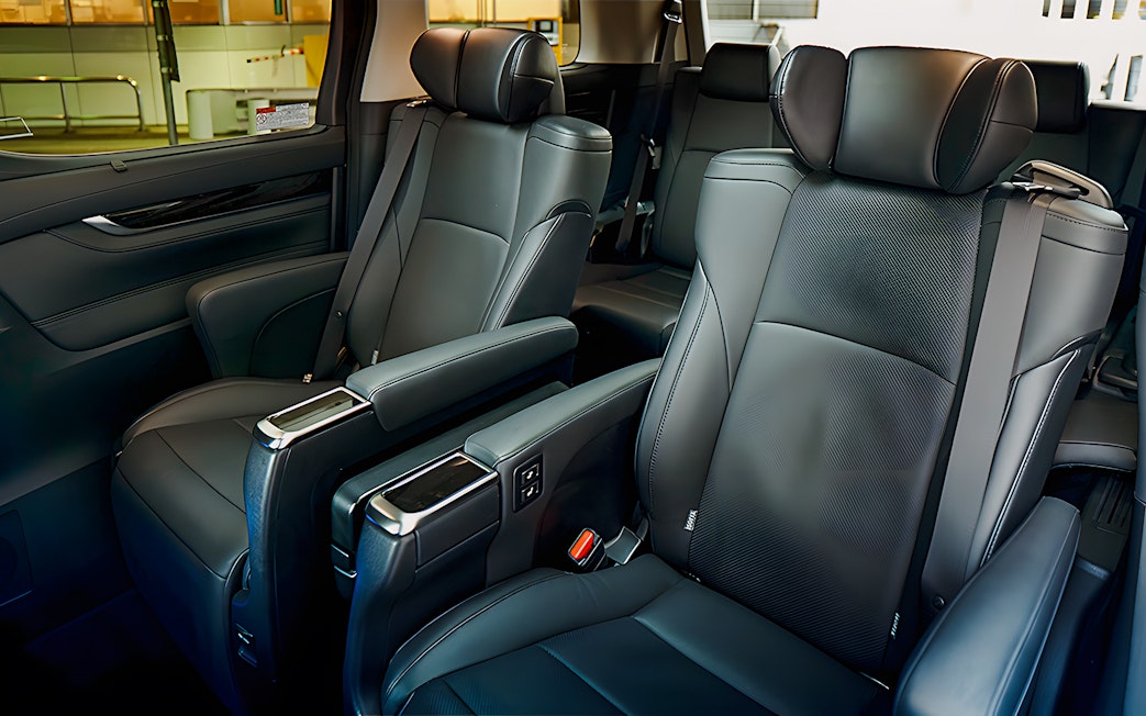 Luxury interior of private car for airport transfer with leather seats.
