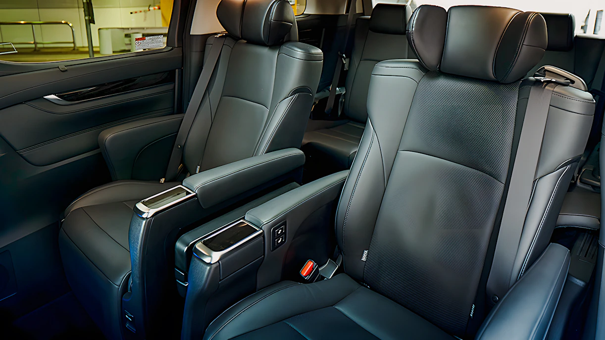 Luxury interior of private car for airport transfer with leather seats.