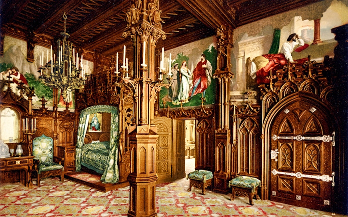 Neuschwanstein Castle interior with ornate wooden carvings and colorful murals.