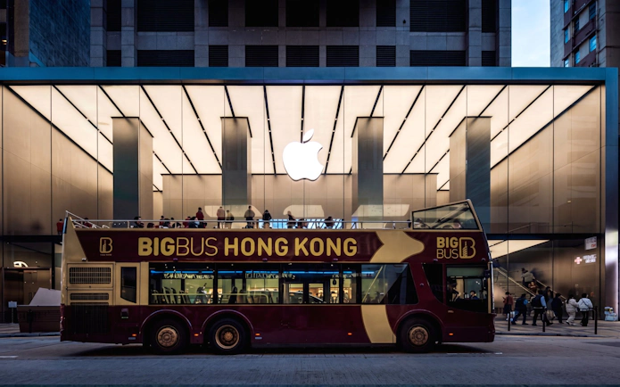 Big Bus Tours Hong Kong in front of Apple Store, city sightseeing.