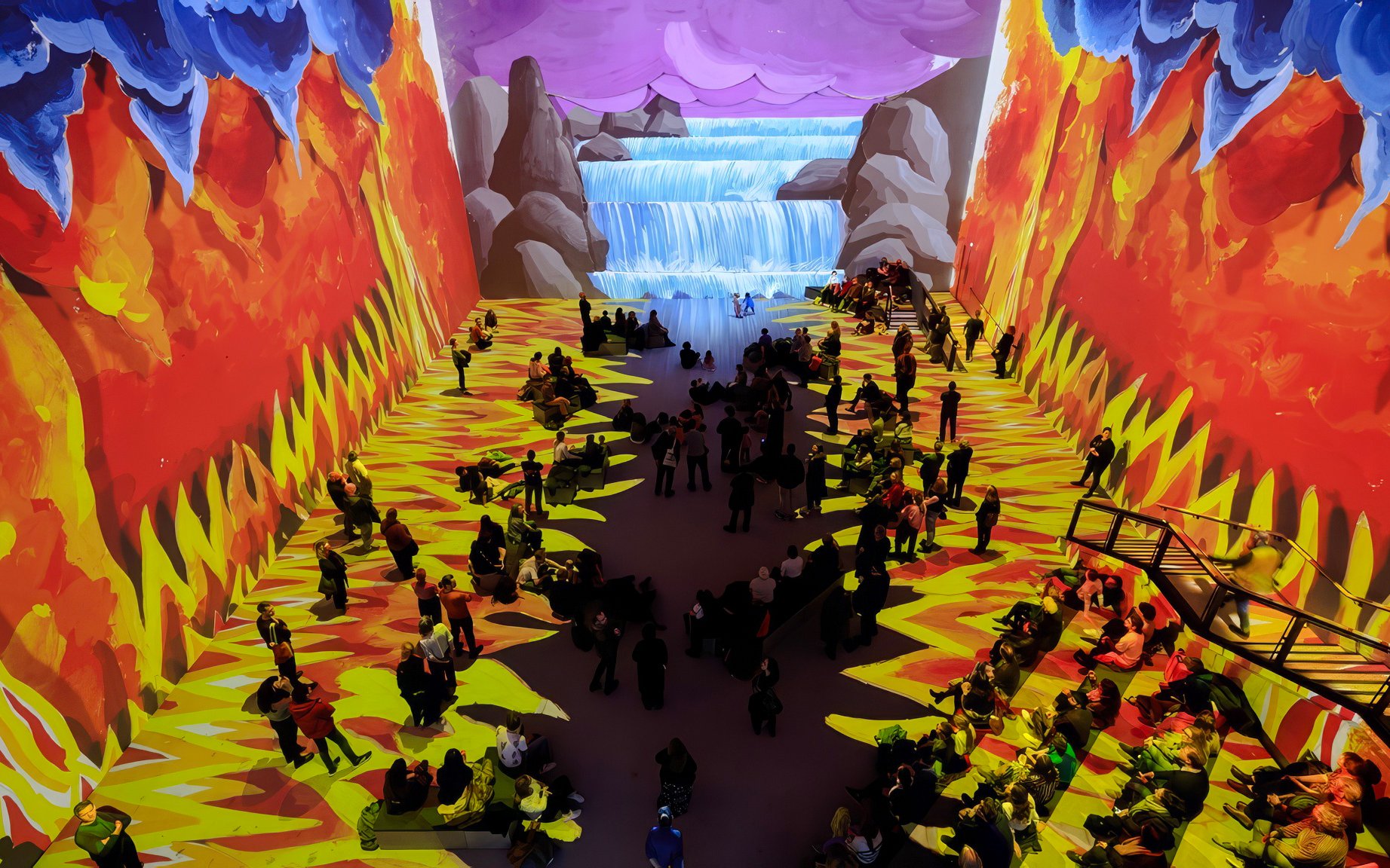 Visitors at David Hockney: Bigger & Closer exhibit, vibrant projections of nature scenes.