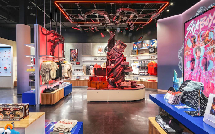 Merchandise display at Netflix House, Pennsylvania featuring themed apparel and decor.