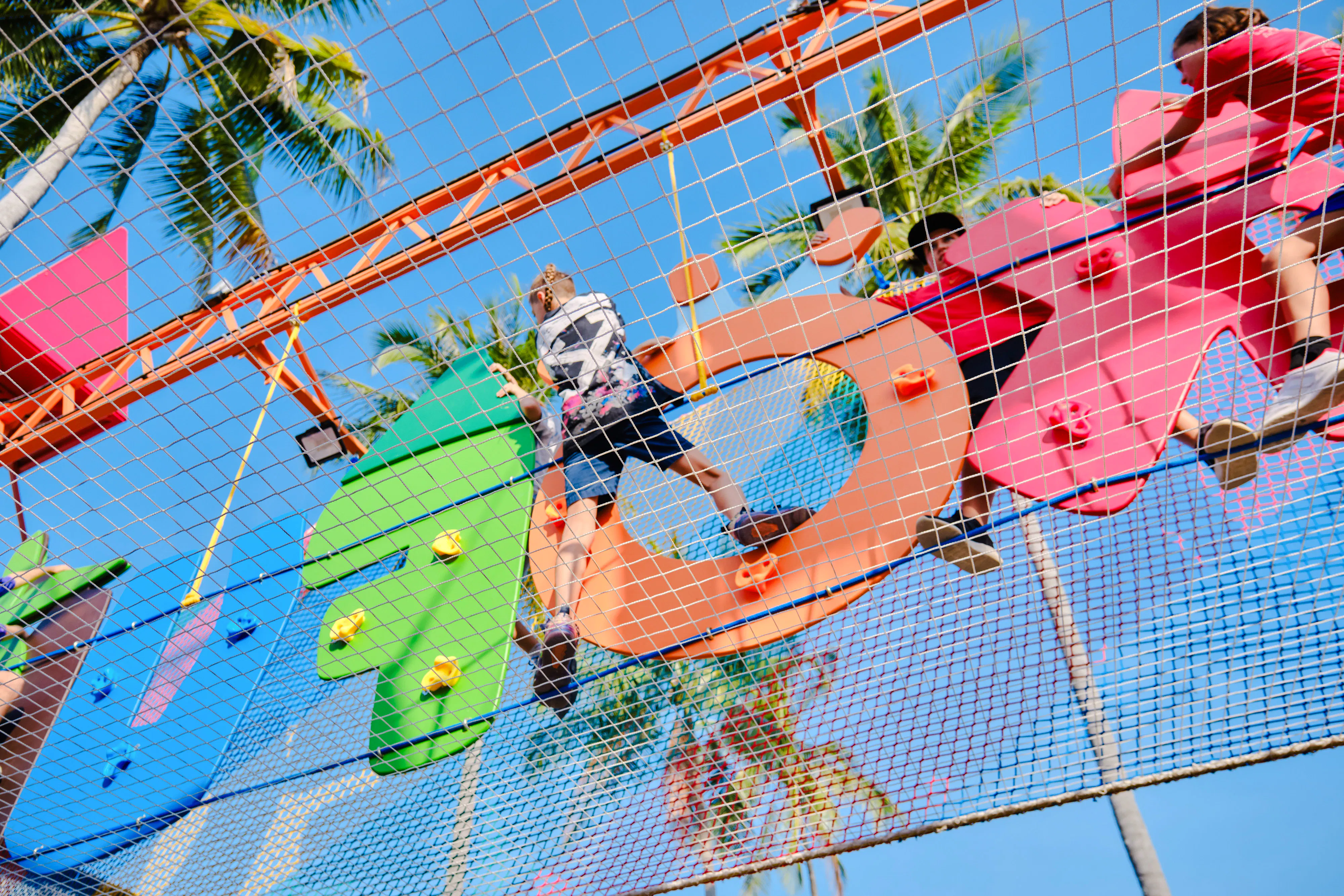 Children climbing colorful obstacle course at a birthday party in Phuket.