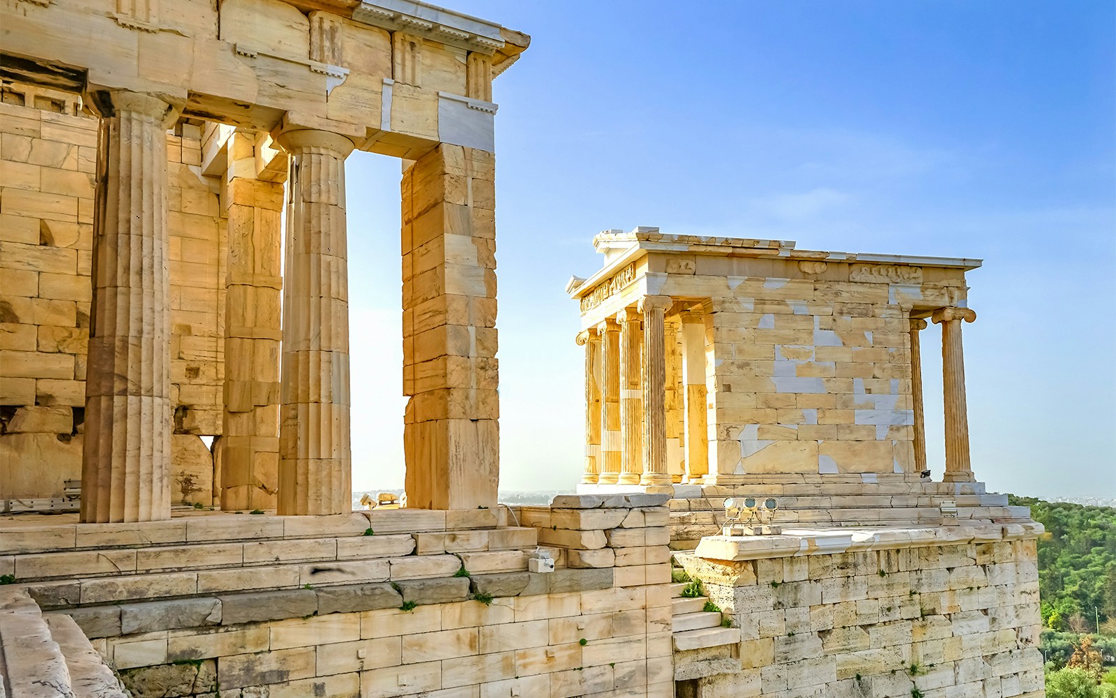 Temple of Athena Nike and Propylaea ruins at Acropolis, Athens, Greece.
