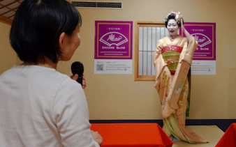 Kyoto Maiko answers questions during a tea ceremony and dance performance.