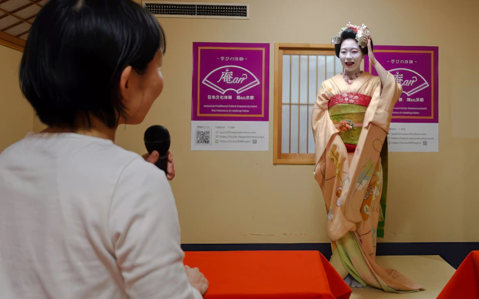 Kyoto Maiko answers questions during a tea ceremony and dance performance.