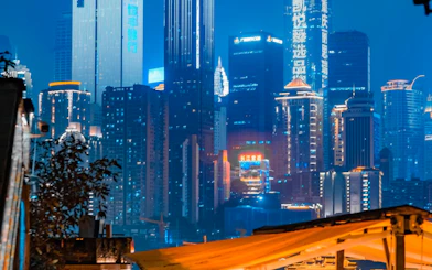 Chongqing skyline illuminated at night, viewed from a rooftop during the Chongqing Night Tour.