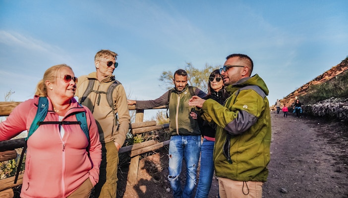 tourists on hiking tour at mount vesuvius