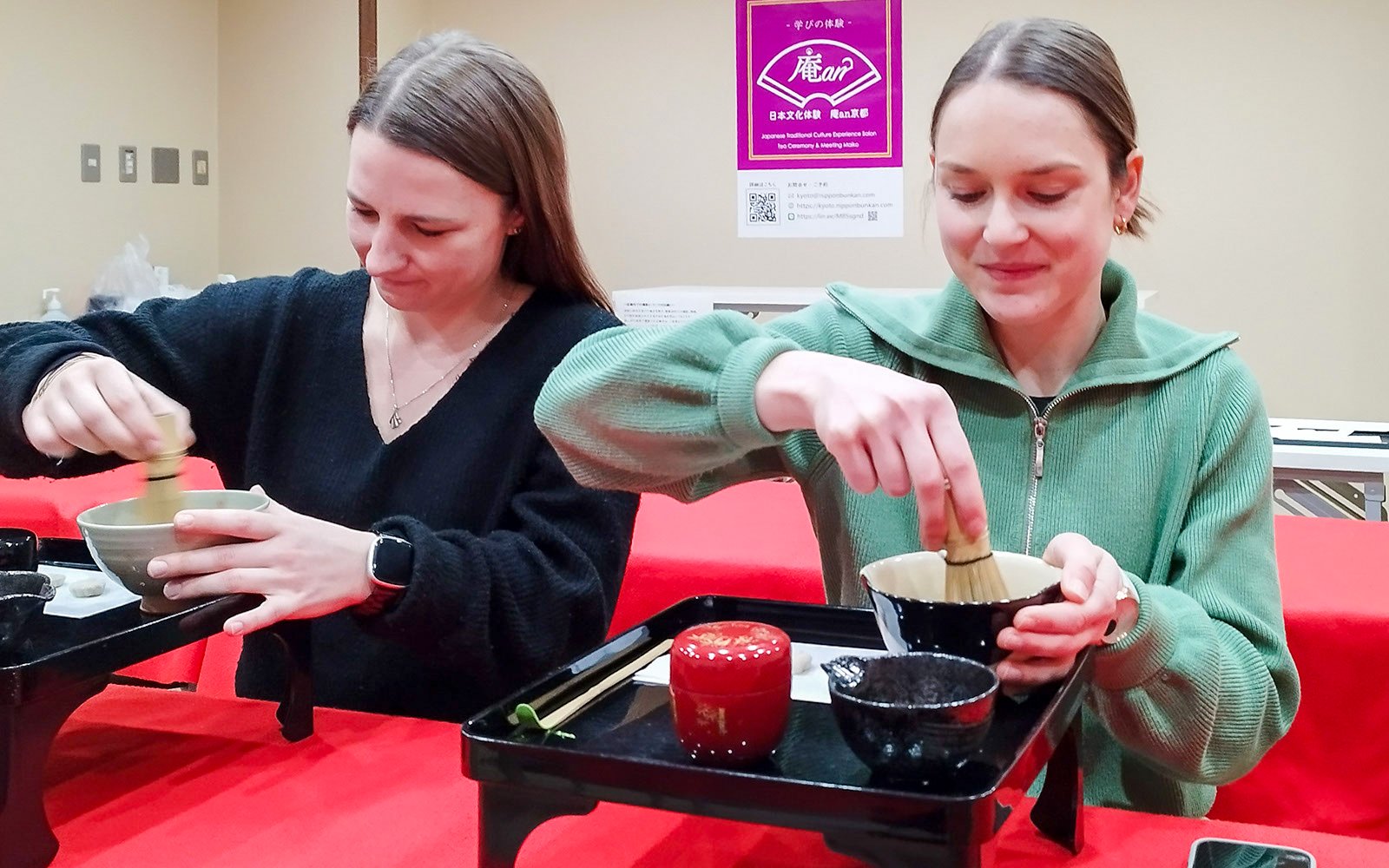 Tourists participating in a tea ceremony in Kyoto's Karasuma area.