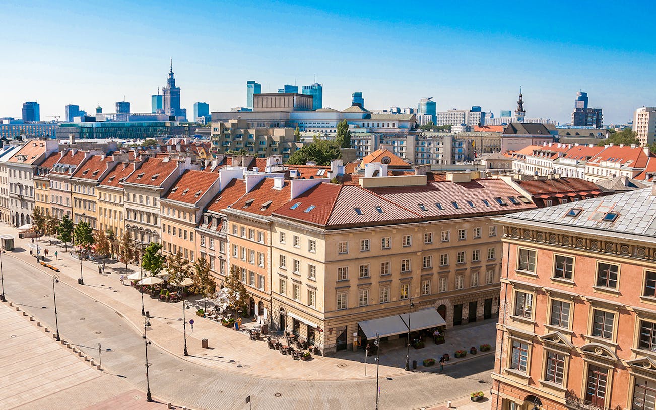 Aerial view of historic buildings in Warsaw city center during a guided tour with hotel transfers.