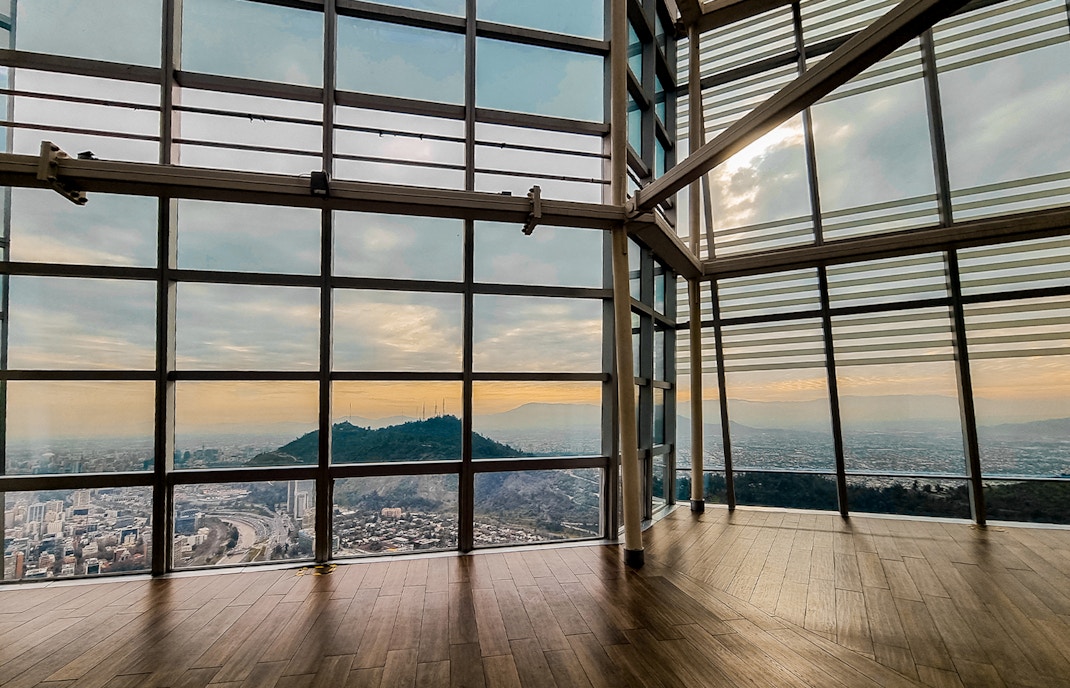 Open air view deck of Sky Costanera, Santiago de Chile, overlooking cityscape and mountains.