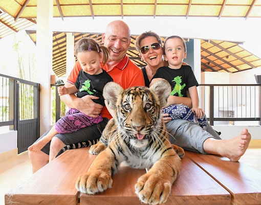 Family Capturing memorable moments with tigers at Pattaya Tiger park