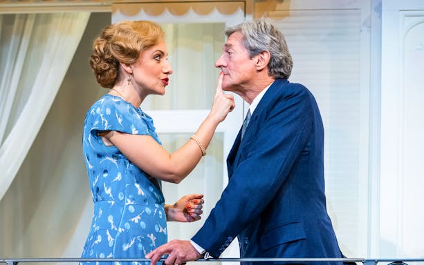 Actors in a scene from the play "Private Lives" on stage.