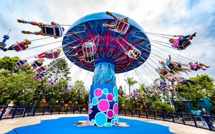 Visitors enjoying a swing ride at SeaWorld San Diego.
