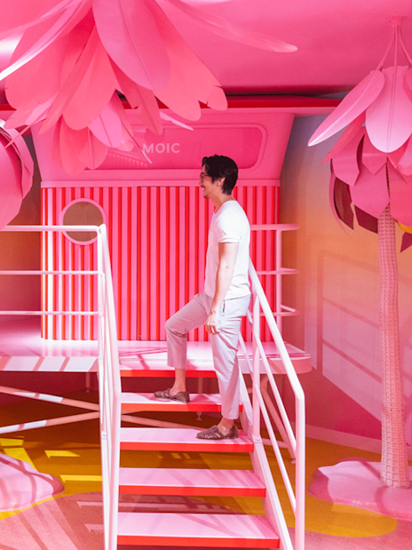 Visitors exploring vibrant pink room at Museum of Ice Cream, Singapore.
