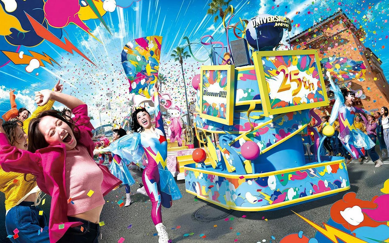 Colorful parade float with performers celebrating Universal Japan's 25th anniversary, confetti in the air.