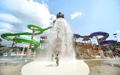 Water park with large slides and splash zone at Six Flags Over Georgia, Paradise Island.