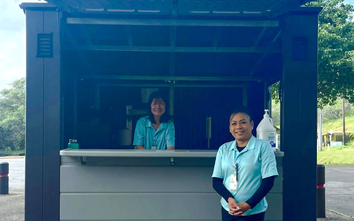Staff at Hanauma Bay Nature Preserve information kiosk.