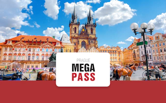 Old Town Square in Prague with Tyn Church and horse-drawn carriages.
