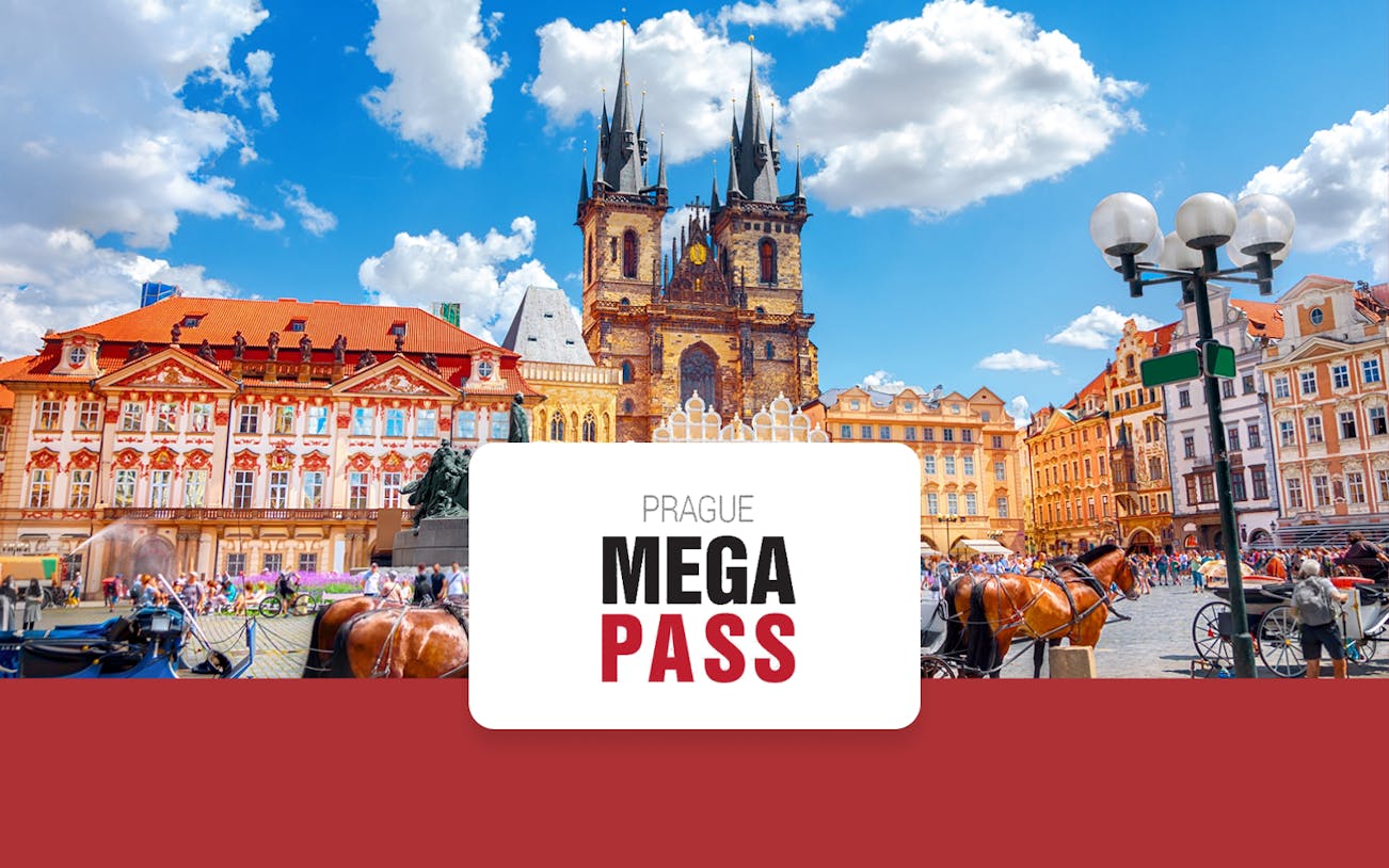 Old Town Square in Prague with Tyn Church and horse-drawn carriages.