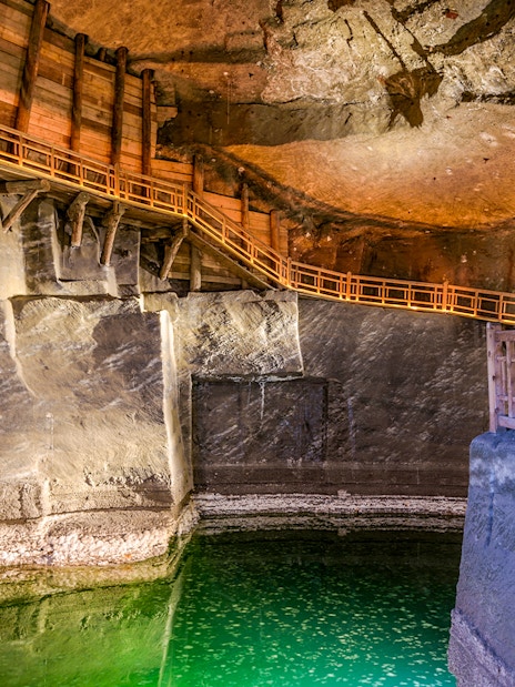 Underground lake with wooden walkways in Wieliczka Salt Mine, Poland.
