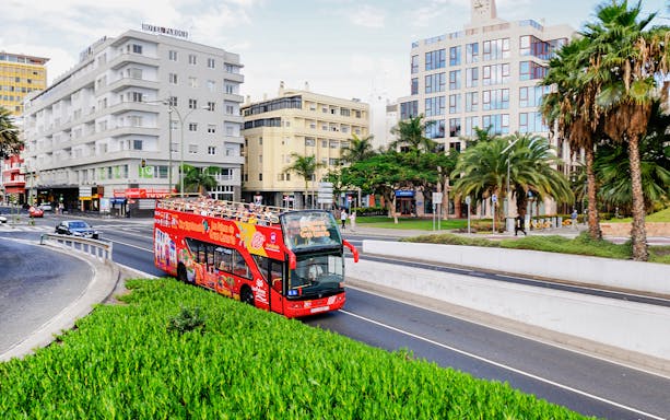 Hop-On Hop-Off bus touring Las Palmas de Gran Canaria city streets.