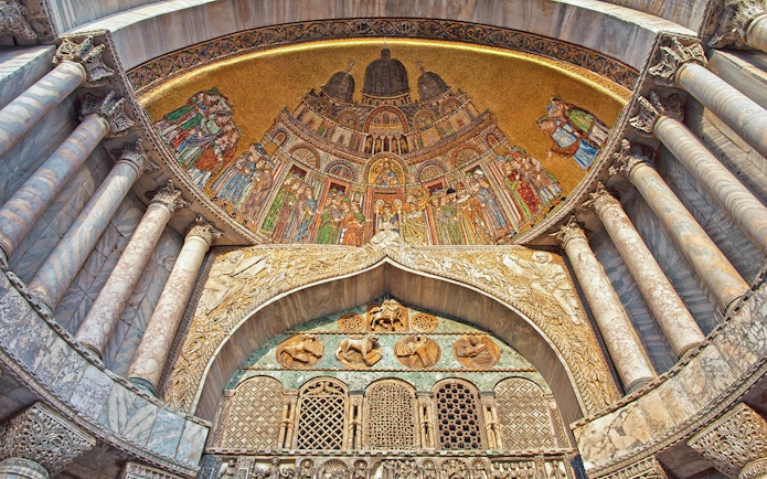 Mosaic and marble columns inside St. Mark's Basilica, Venice.