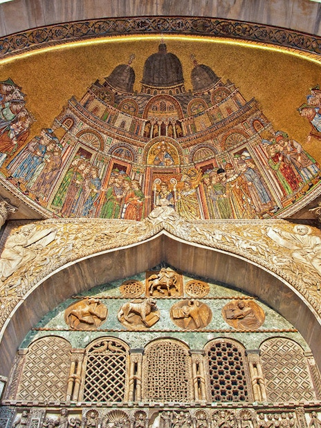 Mosaic and marble columns inside St. Mark's Basilica, Venice.