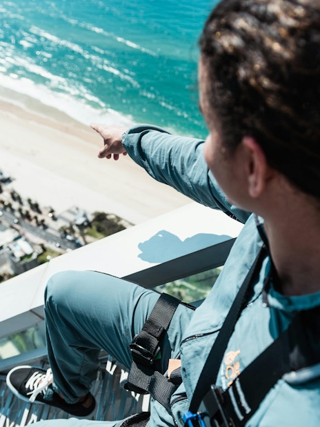 Guests ascending Skypoint Climb overlooking Gold Coast beach.
