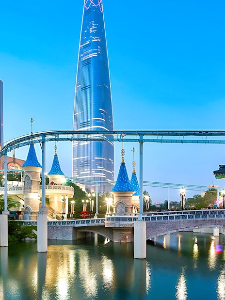 Lotte World park with monorail, traditional Korean architecture, and skyscraper in Seoul.