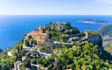 Aerial view of Èze village with Mediterranean Sea in the background.