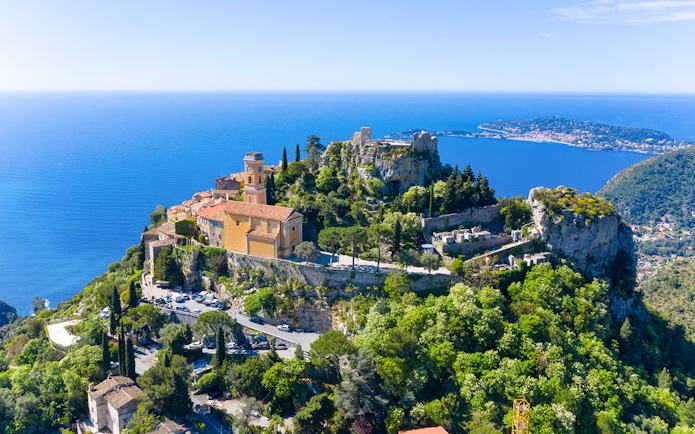 Aerial view of Èze village with Mediterranean Sea in the background.