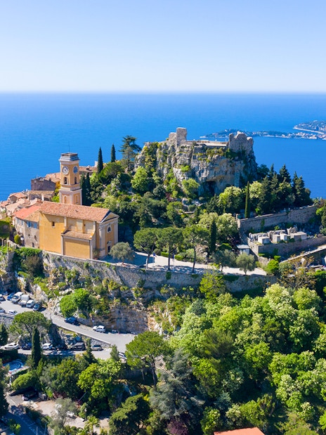 Aerial view of Èze village with Mediterranean Sea in the background.